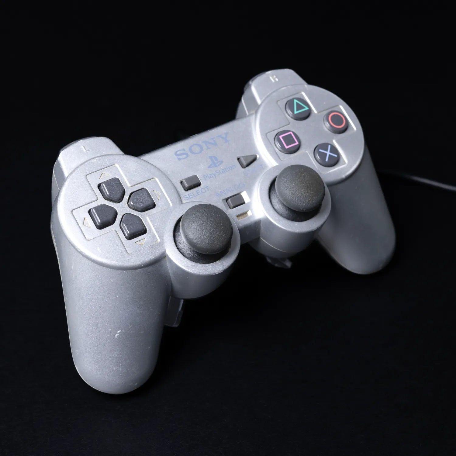 original-playstation-2-dual-shock-controller-fuer-ps2-silber-zustand-gut-1 - Utopia Collectibles