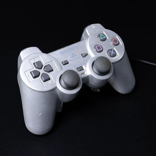 original-playstation-2-dual-shock-controller-fuer-ps2-silber-zustand-gut-1 - Utopia Collectibles
