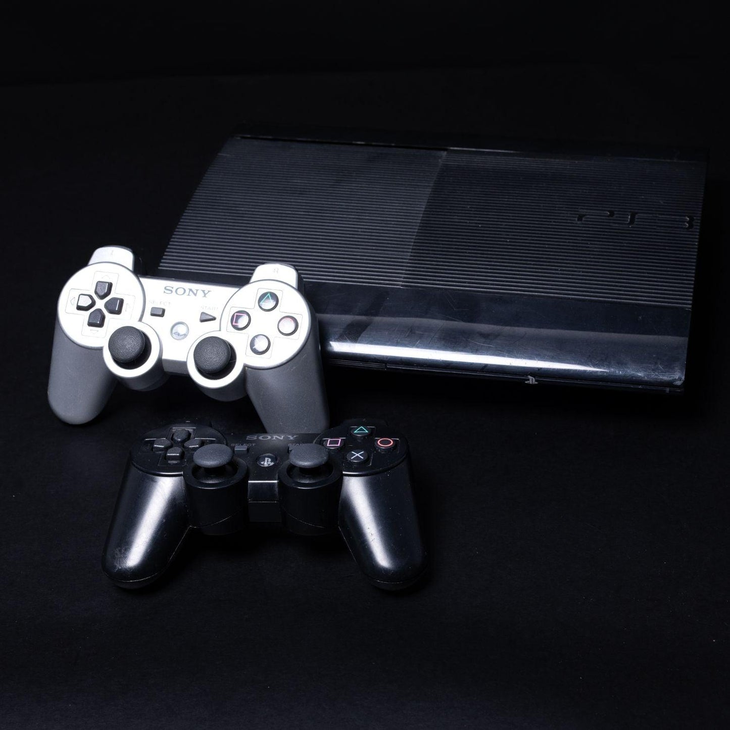 playstation-3-ps3-ultra-slim-konsole-pal-mit-2x-dualshock-3-controller-1 - Utopia Collectibles