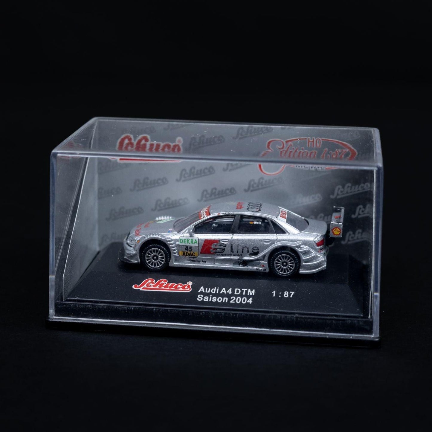schuco-audi-a4-dtm-saison-2004-modellauto-187-mit-mini-showcase-neuwertig-1 - Utopia Collectibles